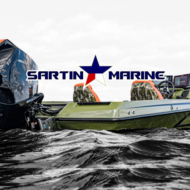 Lake Fork News A close-up, low-angle view captures a fishing boat with camouflage-patterned seats docked on the tranquil waters of Lake Fork in East Texas. The "Sartin Marine" dealership sign—adorned with a bold blue, red, and white star—looms overhead against a partly cloudy sky. The outboard motor and open deck are visible in the foreground, highlighting Lake Fork’s reputation as a premier Southern bass fishing destination. Lake Fork, TX